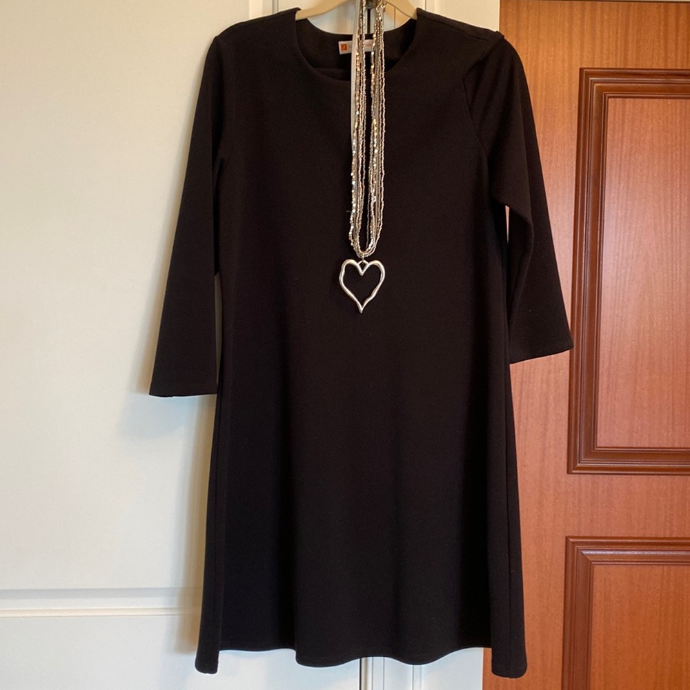 A basic black dress. Necklace priced separately